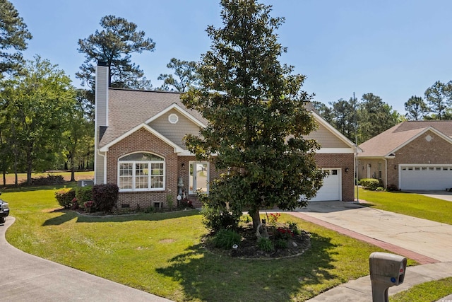 view of front of home featuring a front yard, brick siding, driveway, a chimney, and an attached garage