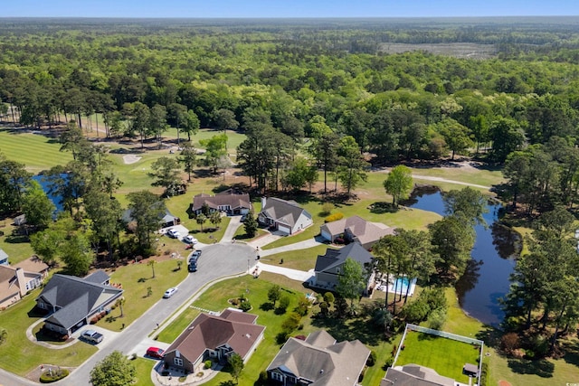 bird's eye view featuring a water view, a view of trees, and a residential view