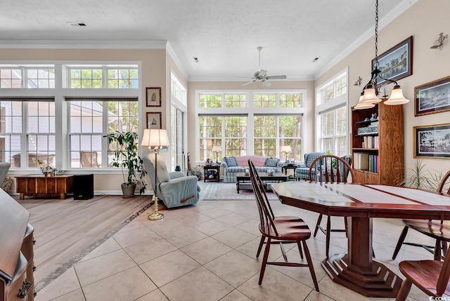 1249 Trent Dr, Murrells Inlet, SC 29576 - dining area featuring plenty of natural light, visible vents, a ceiling fan, and ornamental molding