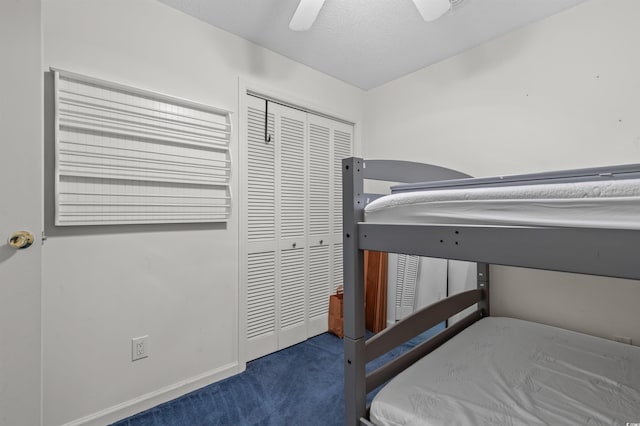 carpeted bedroom with a closet and ceiling fan