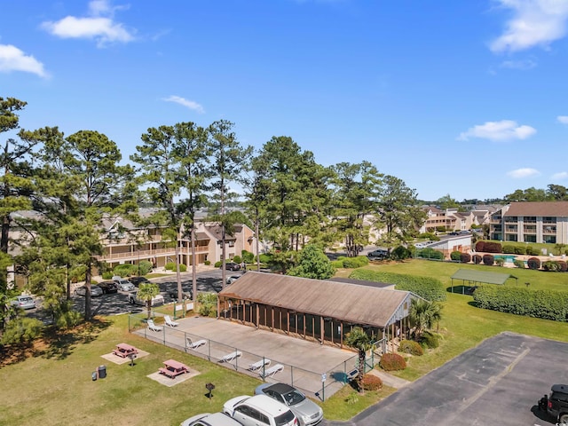 birds eye view of property with a residential view