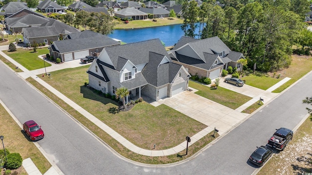 birds eye view of property with a residential view and a water view