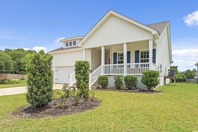 512 Charlton Blvd, Georgetown, SC 29440 - view of front of property featuring covered porch, driveway, a shingled roof, central air condition unit, and a garage
