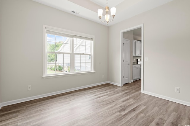 512 Charlton Blvd, Georgetown, SC 29440 - unfurnished room with a chandelier, light wood finished floors, and baseboards