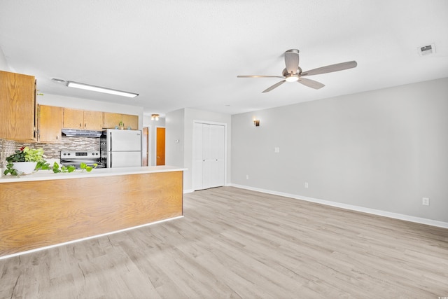 3700 Golf Colony Ln Unit 18-G, Little River, SC 29566 - unfurnished living room featuring light wood-style floors, ceiling fan, and baseboards