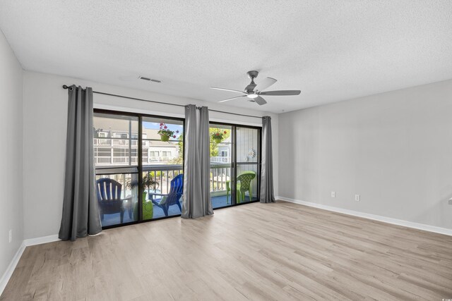 3700 Golf Colony Ln Unit 18-G, Little River, SC 29566 - unfurnished room featuring a textured ceiling, wood finished floors, ceiling fan, and baseboards