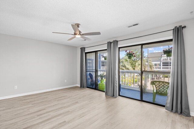 3700 Golf Colony Ln Unit 18-G, Little River, SC 29566 - empty room featuring wood finished floors, a textured ceiling, a ceiling fan, and baseboards