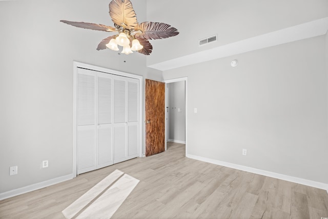 3700 Golf Colony Ln Unit 18-G, Little River, SC 29566 - unfurnished bedroom featuring wood finished floors, baseboards, a closet, and ceiling fan