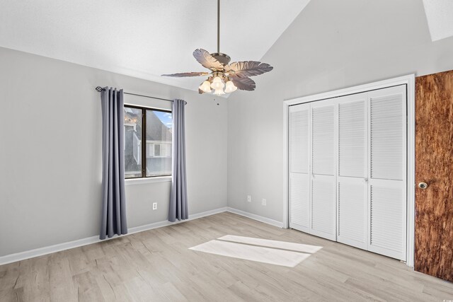 3700 Golf Colony Ln Unit 18-G, Little River, SC 29566 - unfurnished bedroom with light wood-style flooring, lofted ceiling, a closet, ceiling fan, and baseboards