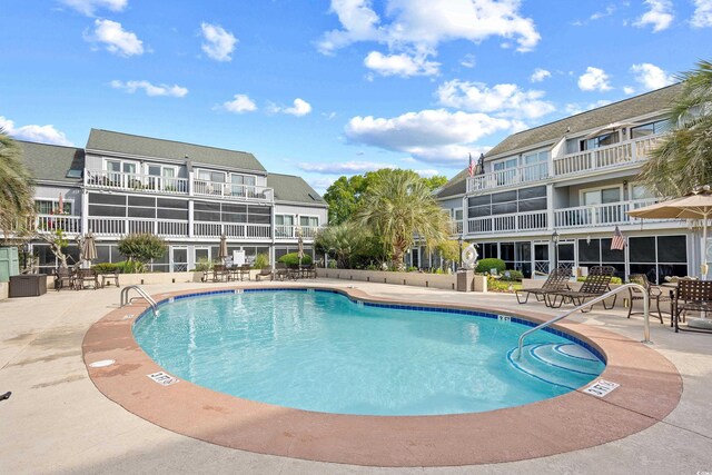 3700 Golf Colony Ln Unit 18-G, Little River, SC 29566 - community pool featuring a patio