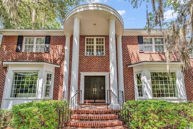 view of front of house with brick siding