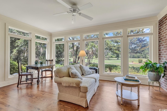 sunroom with wood finished floors and a wooden deck
