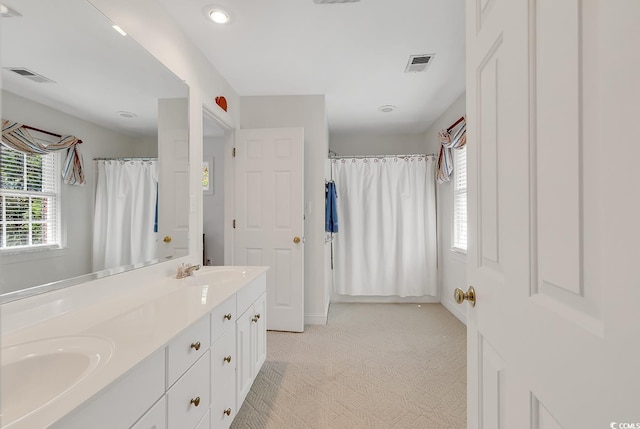 bathroom featuring double vanity, recessed lighting, and a shower with curtain