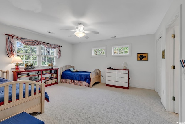 carpeted bedroom with ceiling fan