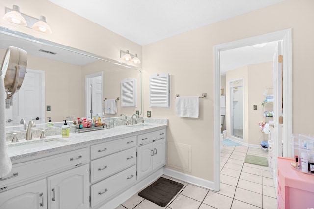8231 Forest Lake Dr, Conway, SC 29526 - bathroom featuring tile patterned floors, a sink, double vanity, baseboards, and visible vents