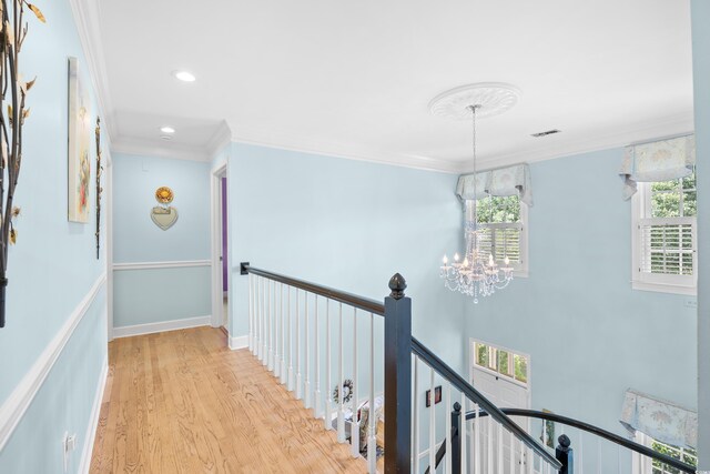 8231 Forest Lake Dr, Conway, SC 29526 - hallway with light wood-style flooring, visible vents, ornamental molding, and an upstairs landing