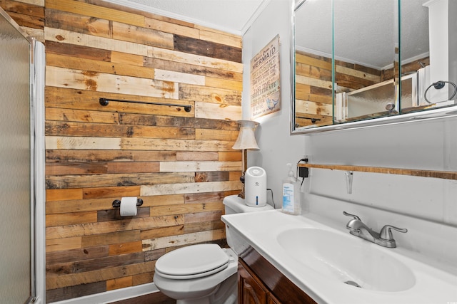 full bath with wooden walls, toilet, a textured ceiling, vanity, and a shower with door