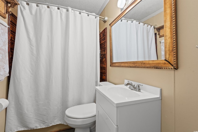 bathroom featuring toilet, vanity, a textured ceiling, and a shower with curtain