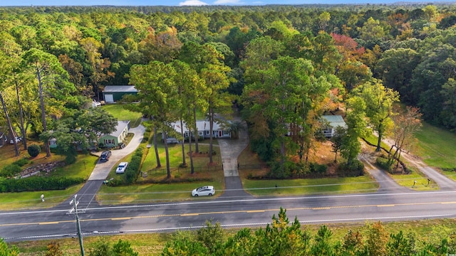 view of property location featuring a heavily wooded area