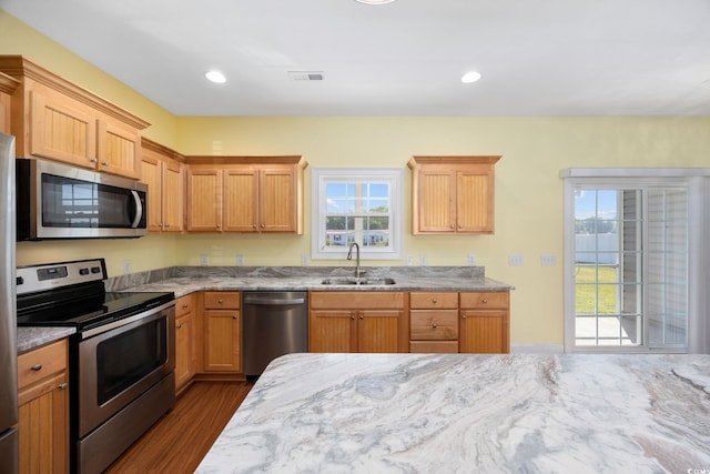 237 Copperwood Loop, Conway, SC 29526 - kitchen featuring appliances with stainless steel finishes, a sink, healthy amount of natural light, and light stone countertops