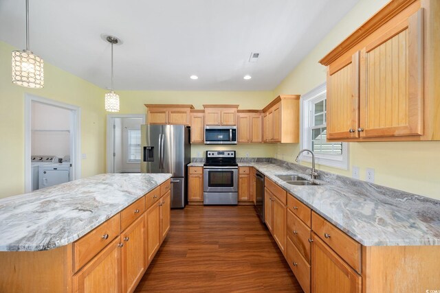 237 Copperwood Loop, Conway, SC 29526 - kitchen with appliances with stainless steel finishes, a sink, separate washer and dryer, dark wood-type flooring, and light stone countertops