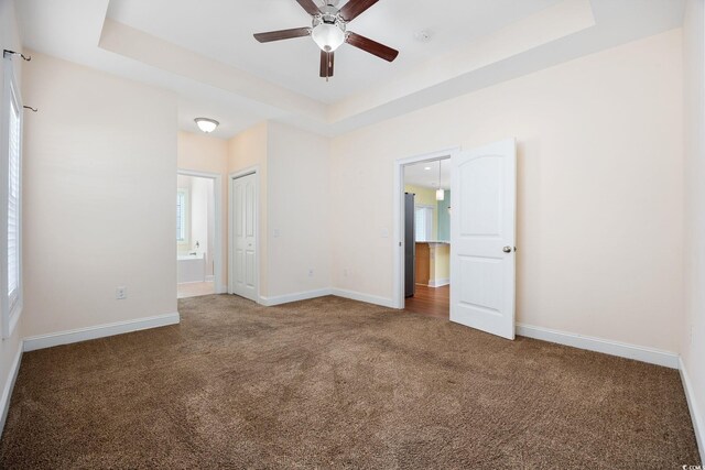 237 Copperwood Loop, Conway, SC 29526 - unfurnished bedroom with carpet, a raised ceiling, baseboards, ensuite bathroom, and a closet