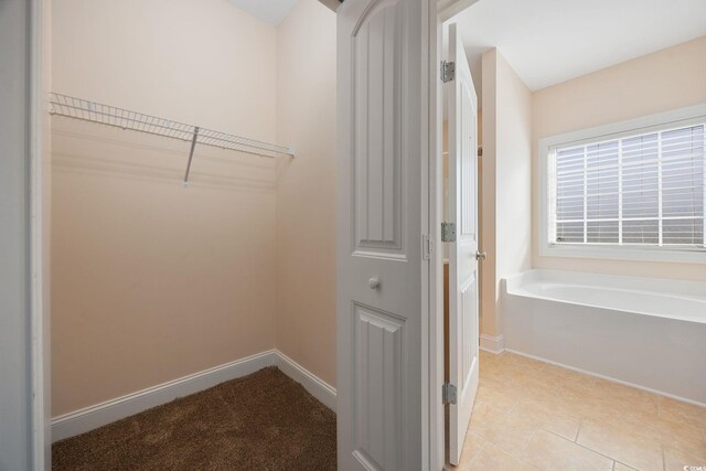 237 Copperwood Loop, Conway, SC 29526 - walk in closet featuring tile patterned floors