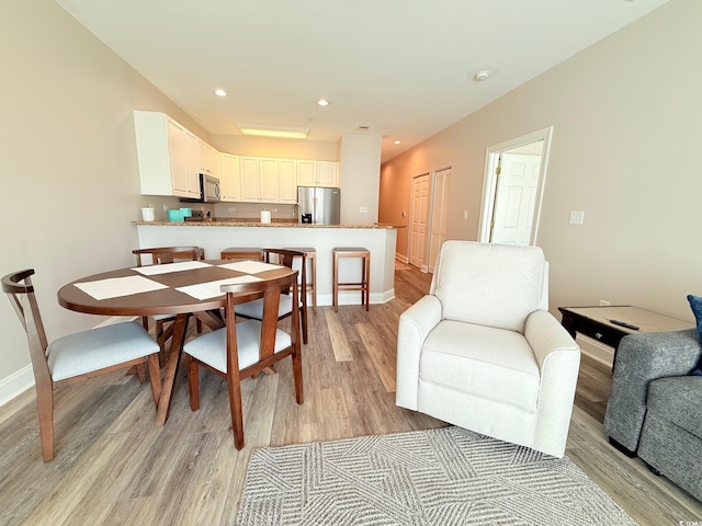 1025 World Tour Blvd Unit 205, Myrtle Beach, SC 29579 - dining space with light wood finished floors, baseboards, and recessed lighting