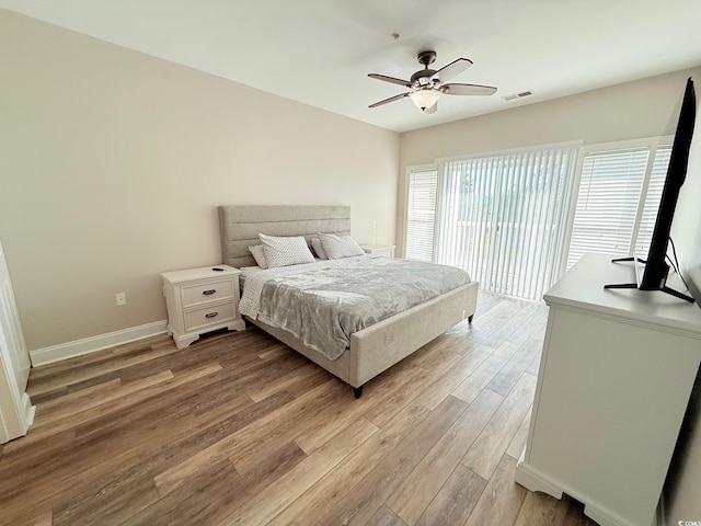 1025 World Tour Blvd Unit 205, Myrtle Beach, SC 29579 - bedroom with light wood-style flooring, visible vents, baseboards, and ceiling fan