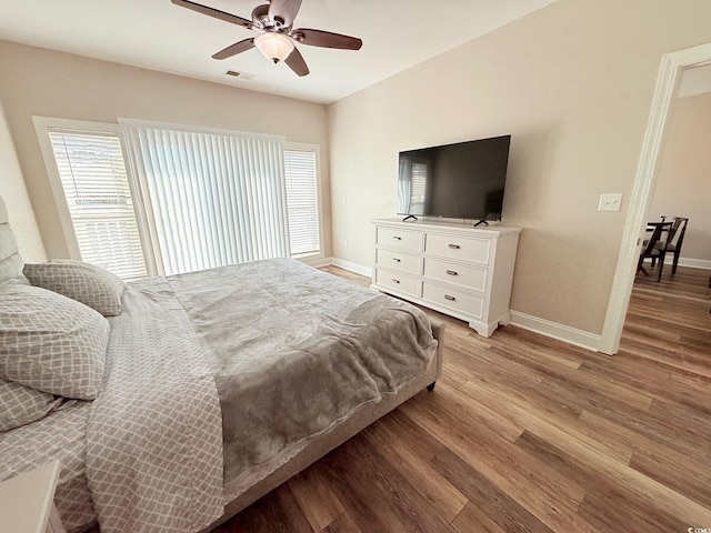 1025 World Tour Blvd Unit 205, Myrtle Beach, SC 29579 - bedroom featuring light wood-type flooring, baseboards, visible vents, and multiple windows