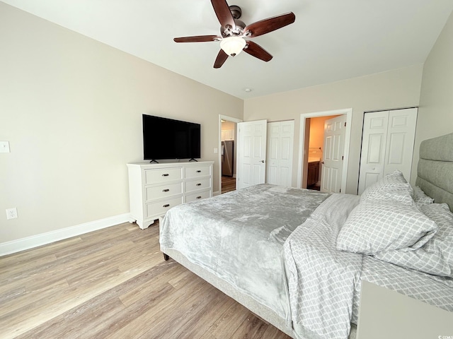 1025 World Tour Blvd Unit 205, Myrtle Beach, SC 29579 - bedroom with light wood-style flooring, a ceiling fan, baseboards, and two closets