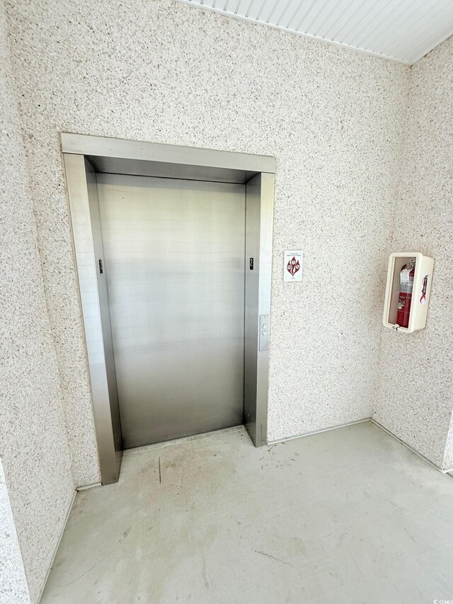 1025 World Tour Blvd Unit 205, Myrtle Beach, SC 29579 - doorway to property with elevator and stucco siding