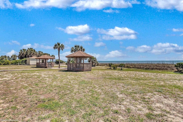 5507 N Ocean Blvd Unit 105, Myrtle Beach, SC 29577 - view of green lawn with a gazebo and a water view