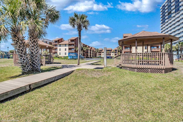 5507 N Ocean Blvd Unit 105, Myrtle Beach, SC 29577 - view of grassy yard with a deck