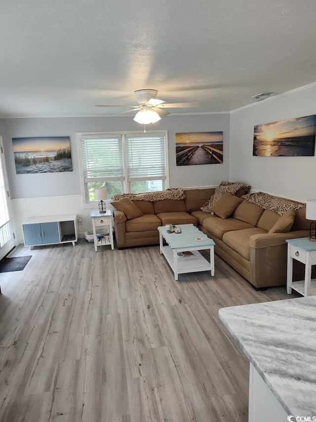 725 Juniper Dr, Surfside Beach, SC 29575 - living room with healthy amount of natural light, light wood finished floors, and a ceiling fan