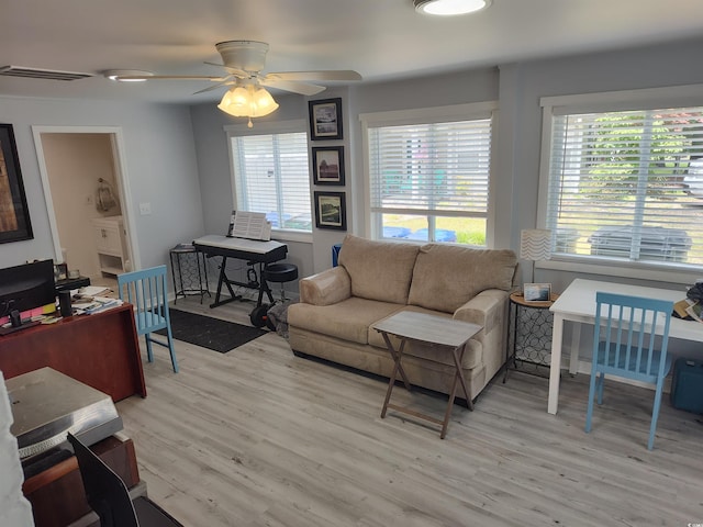725 Juniper Dr, Surfside Beach, SC 29575 - living room featuring light wood-style flooring, a desk, and ceiling fan