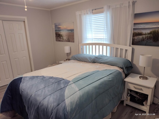 725 Juniper Dr, Surfside Beach, SC 29575 - bedroom featuring wood finished floors, ornamental molding, and a closet