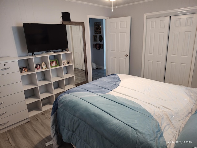 725 Juniper Dr, Surfside Beach, SC 29575 - bedroom featuring ornamental molding, wood finished floors, and a closet