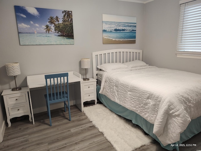 725 Juniper Dr, Surfside Beach, SC 29575 - bedroom with wood finished floors, crown molding, and a desk
