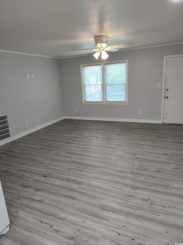 725 Juniper Dr, Surfside Beach, SC 29575 - empty room featuring ornamental molding, ceiling fan, baseboards, and wood finished floors