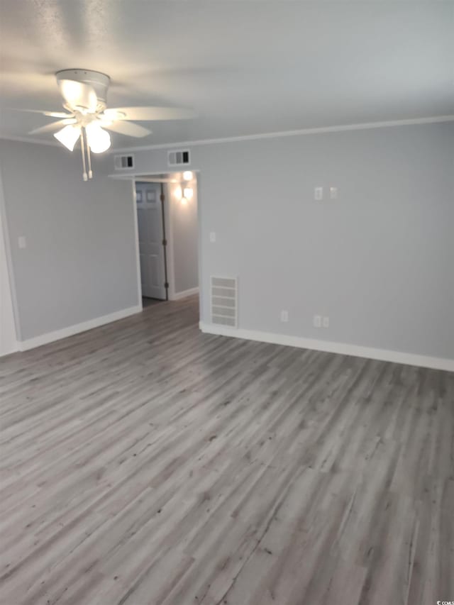 725 Juniper Dr, Surfside Beach, SC 29575 - spare room with ornamental molding, wood finished floors, baseboards, and ceiling fan