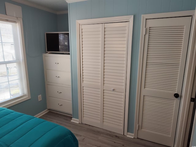 725 Juniper Dr, Surfside Beach, SC 29575 - bedroom featuring crown molding, wood finished floors, and baseboards