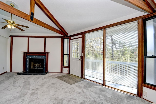 742 Tall Oaks Ct, Myrtle Beach, SC 29588 - unfurnished living room with lofted ceiling with beams, a fireplace, carpet floors, and ceiling fan