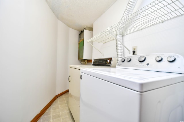742 Tall Oaks Ct, Myrtle Beach, SC 29588 - washroom with a textured ceiling, baseboards, washer and dryer, and laundry area