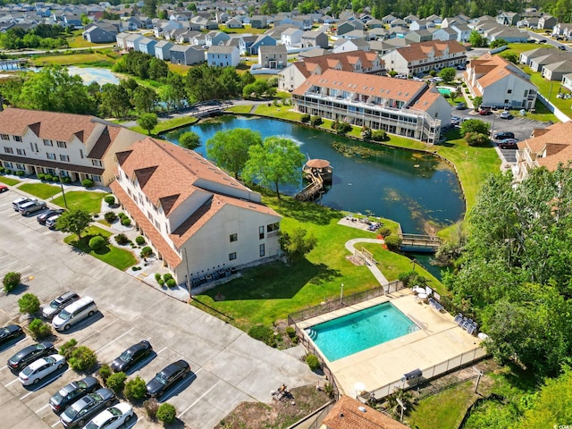 aerial view of a nearby body of water and a pool area