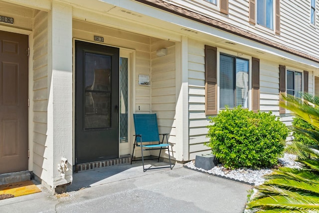doorway to property with a porch