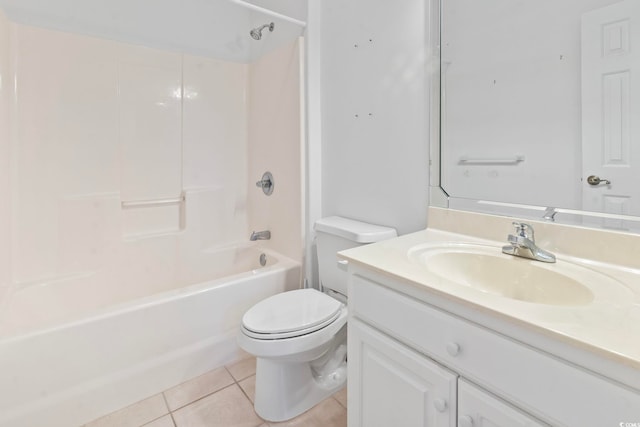 bathroom with vanity, tile patterned flooring, washtub / shower combination, and toilet