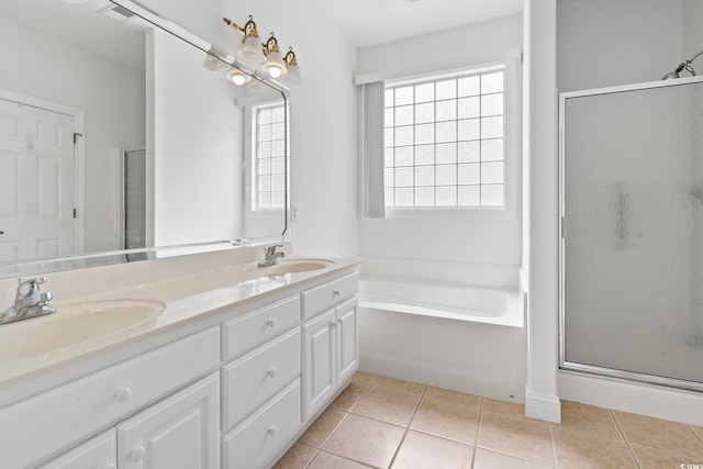 full bathroom with a shower stall, tile patterned floors, and a sink