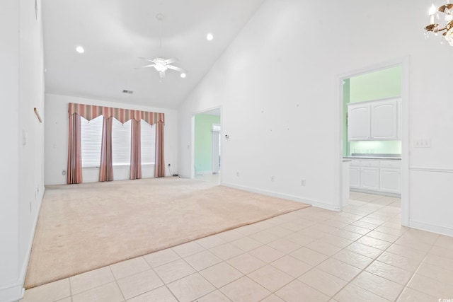 spare room with high vaulted ceiling, ceiling fan, light colored carpet, visible vents, and recessed lighting