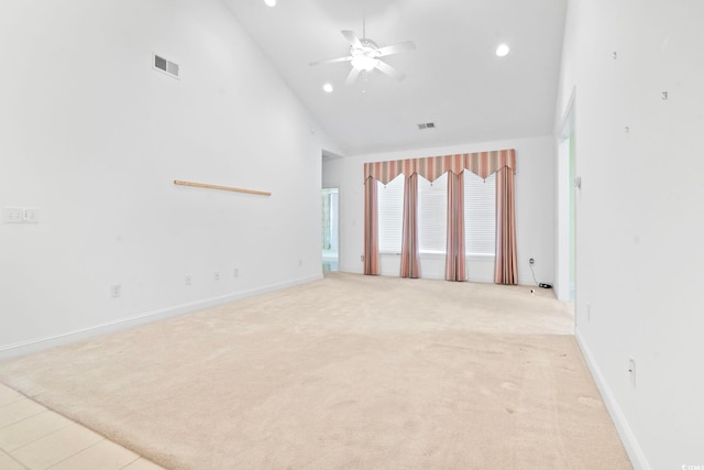 spare room with high vaulted ceiling, light carpet, a ceiling fan, and recessed lighting